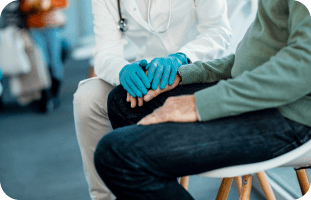 Doctor explaining why Myasthenia Gravis happens to a patient