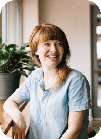 Smiling caregiver, emphasizing the importance of self-care for caregivers