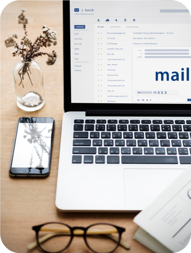 Laptop and smartphone showing email subscription for MG updates